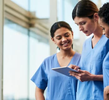 nurses discussing chart